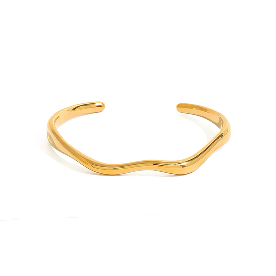 Gold bracelet on a white background