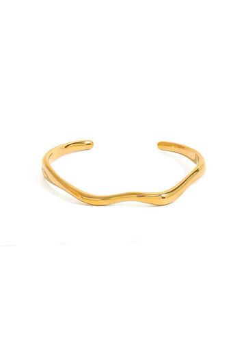 Gold bracelet on a white background