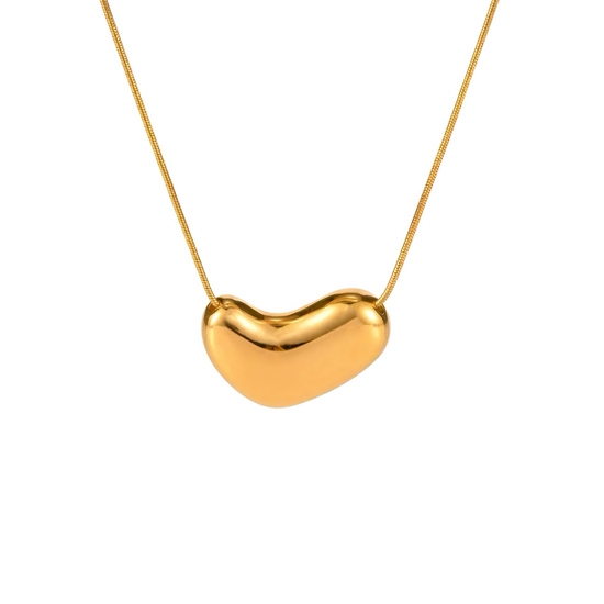 Gold heart-shaped pendant necklace on a white background