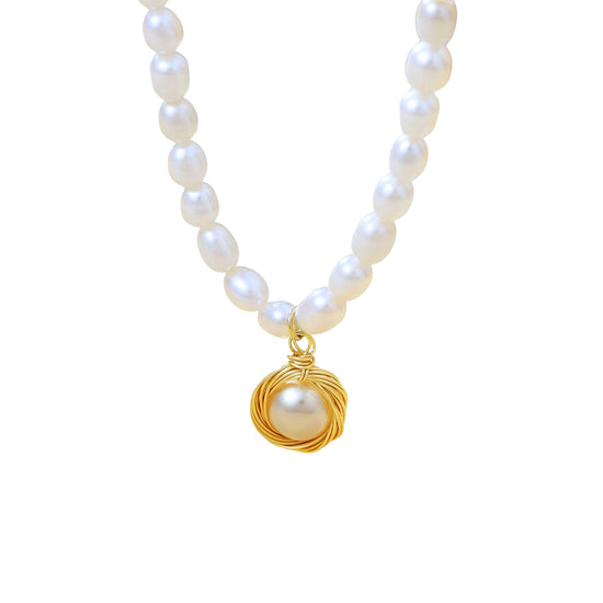Pearl necklace with a gold pendant on a white background