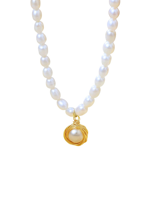 Pearl necklace with a gold pendant on a white background