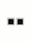 Pair of silver square stud earrings with black centers on a white background