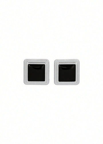Pair of silver square stud earrings with black centers on a white background