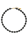 Black beaded necklace with a gold clasp on a white background