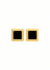 Pair of square-shaped earrings with black centers and gold borders on a white background