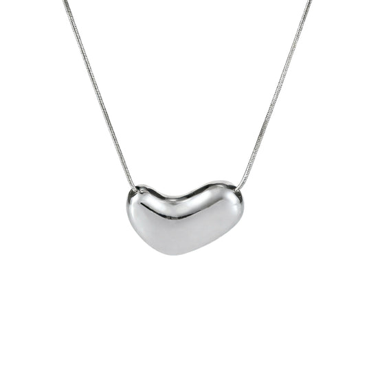 Silver heart-shaped pendant on a chain against a white background