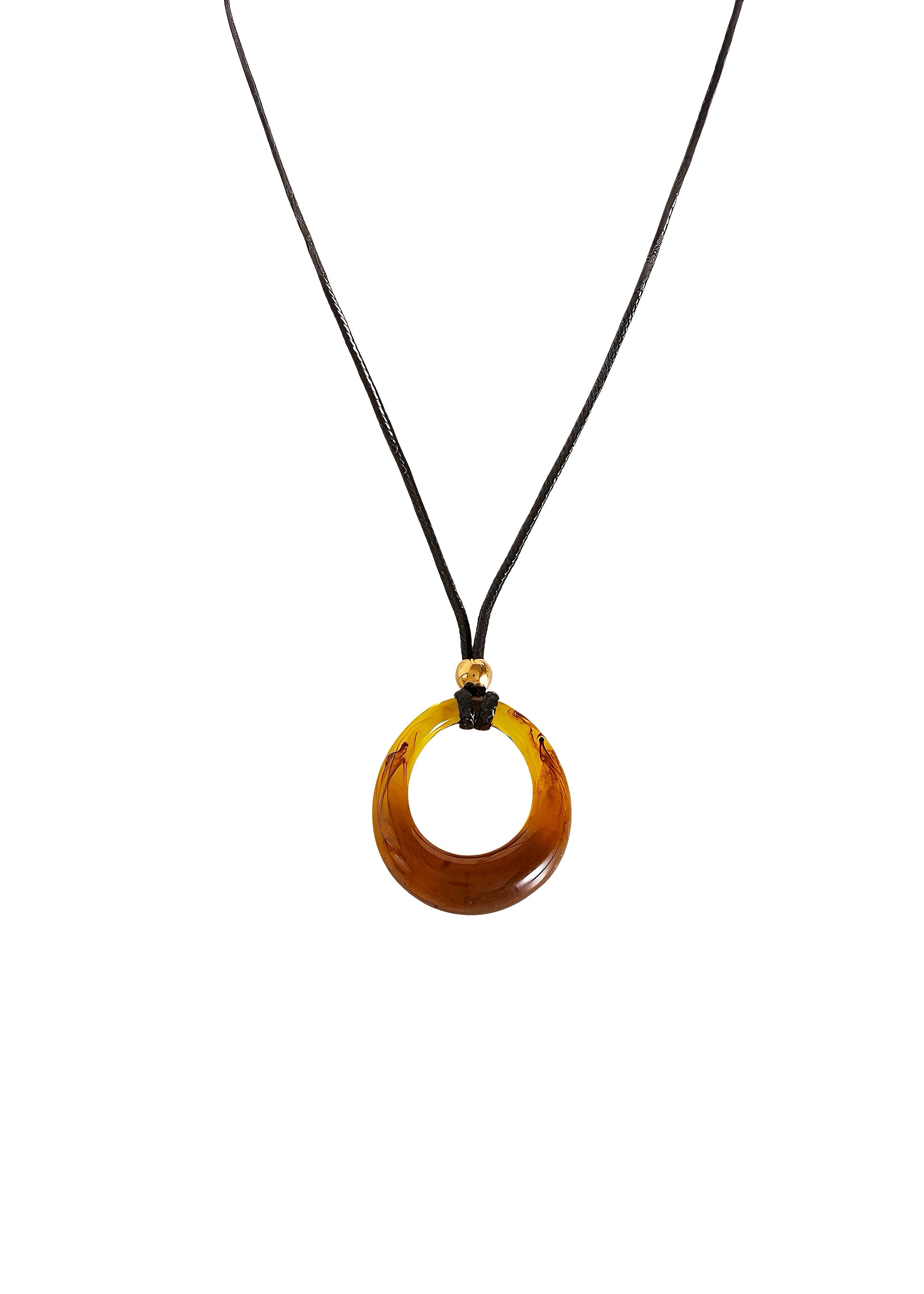 Amber circular pendant on a black cord against a white background