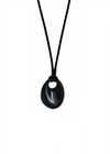 Black oval pendant necklace on a white background