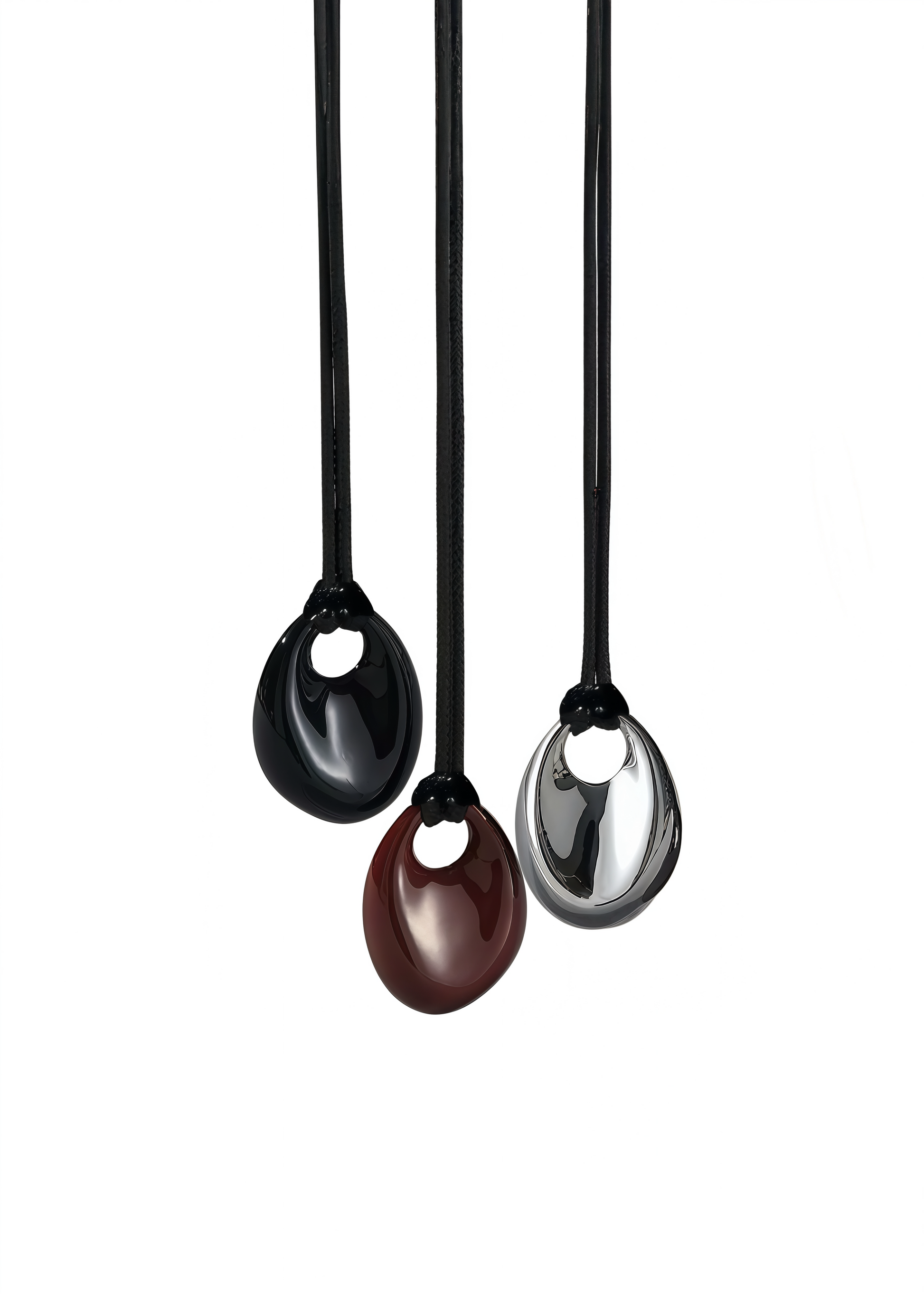 Three black pendant necklaces with different colored pendants on a white background