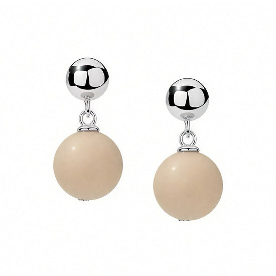 Pair of earrings with beige spherical beads and silver tops on a white background