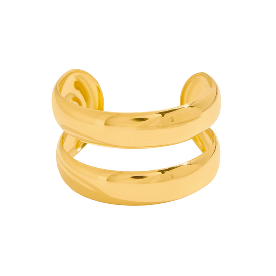 Gold cuff bangle on a white background